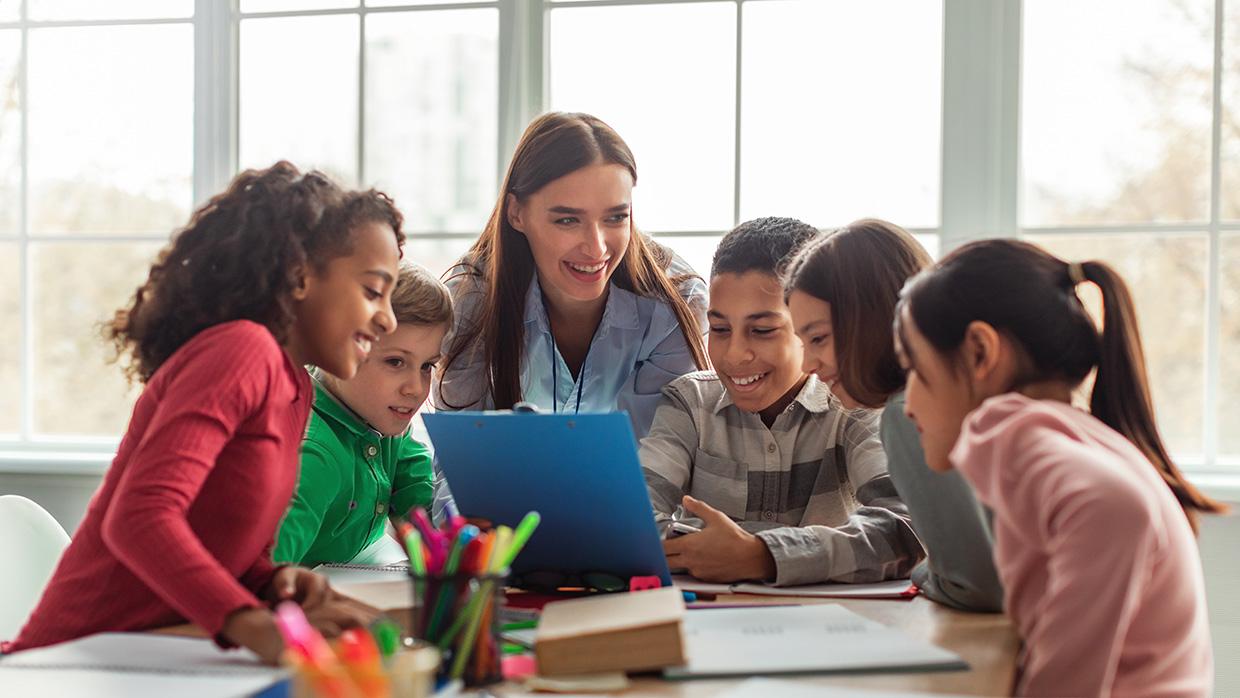 Teacher working with students